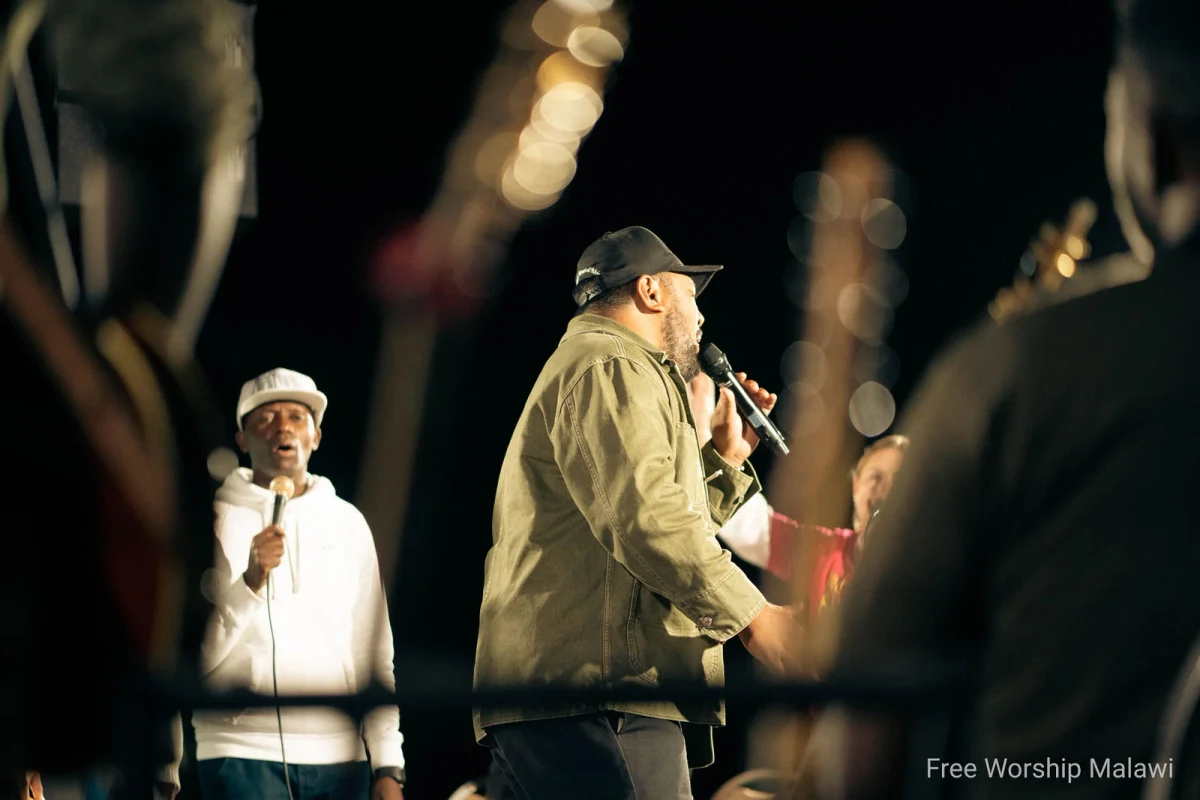 Vocalists and choir in joyful harmony